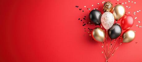 Balloons with confetti on red for party or celebration background use photo
