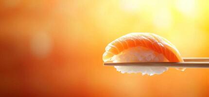 Salmon nigiri held by chopsticks on bright bokeh backdrop for restaurant menu photo