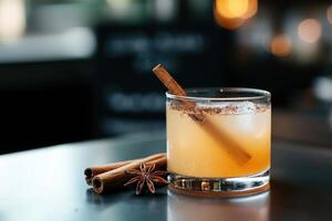 Cinnamon cocktail on bar, blurred background, for menus or blogs photo