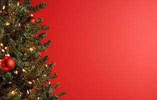 Christmas tree with ornaments and lights on red background for holiday greetings photo