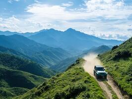 4x4 traversing mountain ridge, scenic valley backdrop photo
