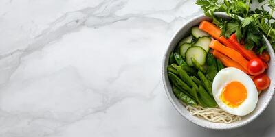 Healthy food in bowl on marble table. Balanced meal, diet or nutrition photo
