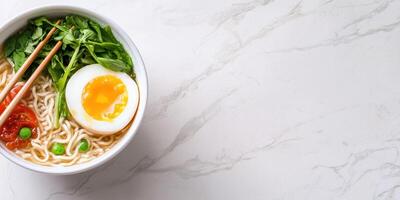 Noodles with egg are ready to eat on a marble top, food blog usage photo