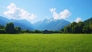 Meadow, Cabin, Mountains Open field to home, snowy range background. Ad space photo