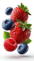Falling Strawberry, Blueberry, Raspberry with half sliced isolated on white background. photo