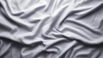 Soft grey fabric surface with gentle folds and light texture minimalist background low angle view photo