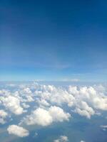 Beautiful and fluffy white cumulus clouds in the blue sky photo