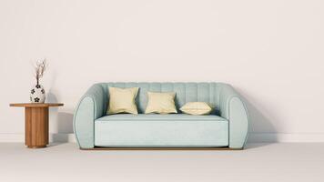 A blue couch and a table in front of a white wall photo