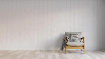 A chair and blanket in an empty room photo