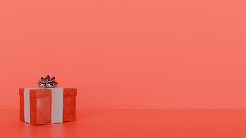 A red gift box with a bow on top of it photo