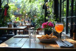 Sunny Garden Cafe Brunch Scene with Fries and Refreshing Drink for Relaxed Dining Experience photo