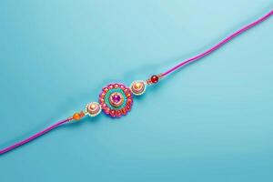 A pink rakhi with a colorful design photo