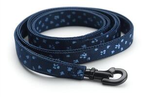 A blue dog leash with paw prints on it photo