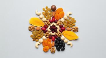 Creative arrangement of dried fruits and nuts forming a decorative pattern photo