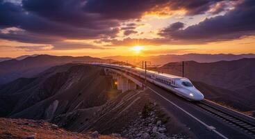 High speed bullet train on a viaduct in a mountainous landscape at dramatic sunset photo