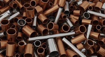 A large pile of various sized copper and steel metal pipes and tubes photo