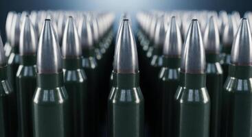 Large group of military rifle bullets standing in organized rows, symbolizing power and defense photo