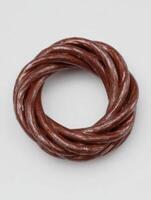 Twisted brown rope forms a circular, textured pattern photo