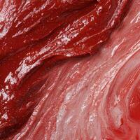 Abstract red paint texture with glossy, vibrant surface photo