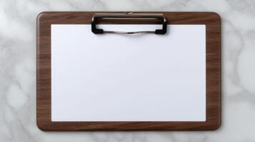Blank clipboard with white paper on marble background photo