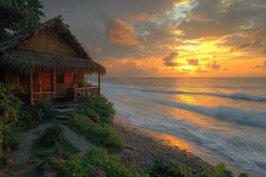 A coastal hut enjoys the sunrise over the endless ocean water photo