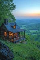 A cozy cabin in a picturesque mountain environment at dusk photo