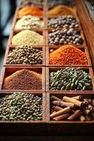 Assortment of aromatic spices displayed in small wooden boxes photo