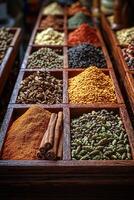 Various Colorful Spices Are Displayed Neatly In Wooden Compartments photo