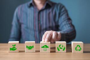 ESG environment social governance,Green Business Innovation and Sustainable Development concept.wood block with icon reduce co2,and reduce global warming,climate change,ecology friendly investment photo