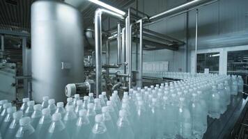 Empty bottles arranged on conveyor machine video