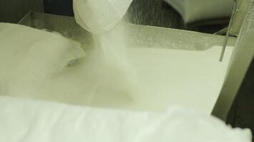 Bulk granulated sugar stored for processing video