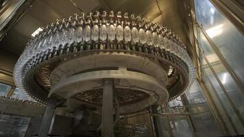 Rotary system moving empty plastic bottles on line video