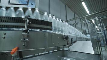 Plastic bottles moving on automated conveyor system video
