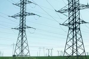 Steel Power Towers Supporting Transmission Cables Overhead photo