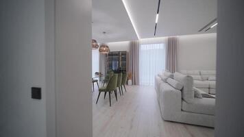 Gray color interior design with large gray sofa with many pillows video