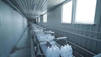 Sterile corridor in bottling plant with rows of packed water containers video