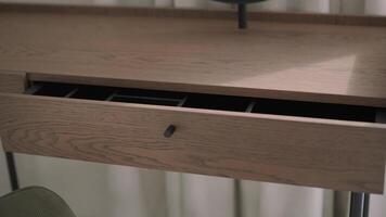 A woman's hand activating the integrated touch lighting on a modern wine cabinet, highlighting the seamless technology and design in a contemporary setting video