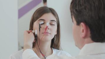 Electrodes applied to face for analysis video