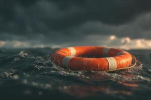 Bright orange life preserver floating on stormy ocean with dark waves and cloudy sky photo