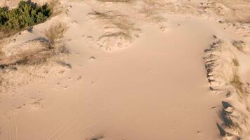 Aerial perspective of soft sand crater with defined shadow and light texture. video