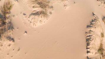 Isolated dune formation in the middle of sand plain viewed from above. video