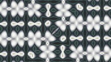 Kaleidoscopic abstract animation featuring symmetrical, morphing patterns in muted greens, blues, and grays. Glowing white outlines pulse gently, forming hypnotic geometric and organic shapes. video
