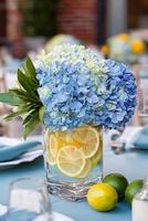 Bright Blue Hydrangeas and Citrus Accents Adorn Elegant Table Setting for Summer Gathering photo
