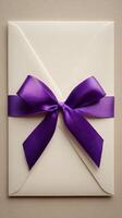 Elegant Envelope With Purple Ribbon Bow for Special Occasion or Event photo