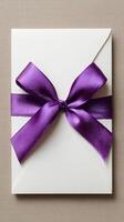 Elegant Envelope With Purple Ribbon Under Natural Light. photo