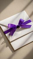 Elegant Envelope With Purple Ribbon Under Natural Light photo