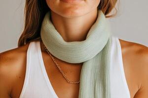 Green Scarf Worn Stylishly by a Model in a Casual Setting During Daylight Hours photo