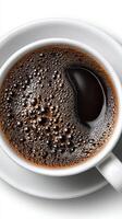 Dark Rich Coffee in a White Cup, Close-Up View Capturing Foam and Texture at a Cozy Cafe photo
