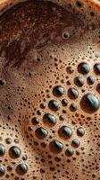 Rich Dark Coffee Foam With Bubbles Captured in Close Detail During Morning Preparation photo