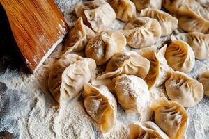Handmade Dumplings Prepared With Fresh Leaves and Flour on a Wooden Surface. photo